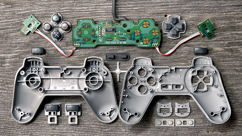 Illustration for article titled Deconstructed Gaming Controllers Reveal Gorgeous Old School Guts